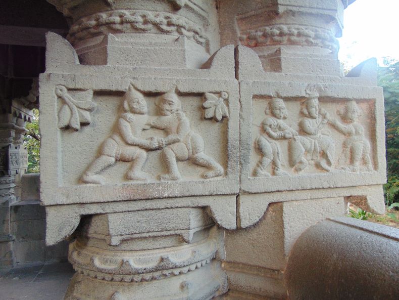 Ardhastambha 2 – Battle scene of Mahiṣāsuramardinī and four deities with asuras, battle and female figure, flowers, flowers.