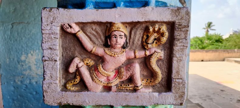 A combat between Garuda and Naga.