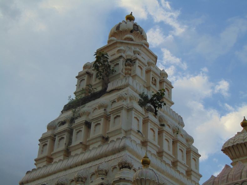 The śikhara on the garbhagṛha.