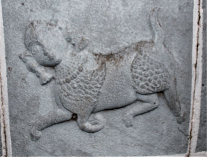 a sculpture of woman and an animal.