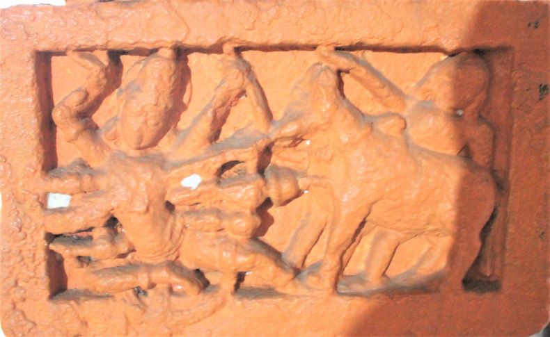 An eight-handed (?) god is shown attacking a bull.
