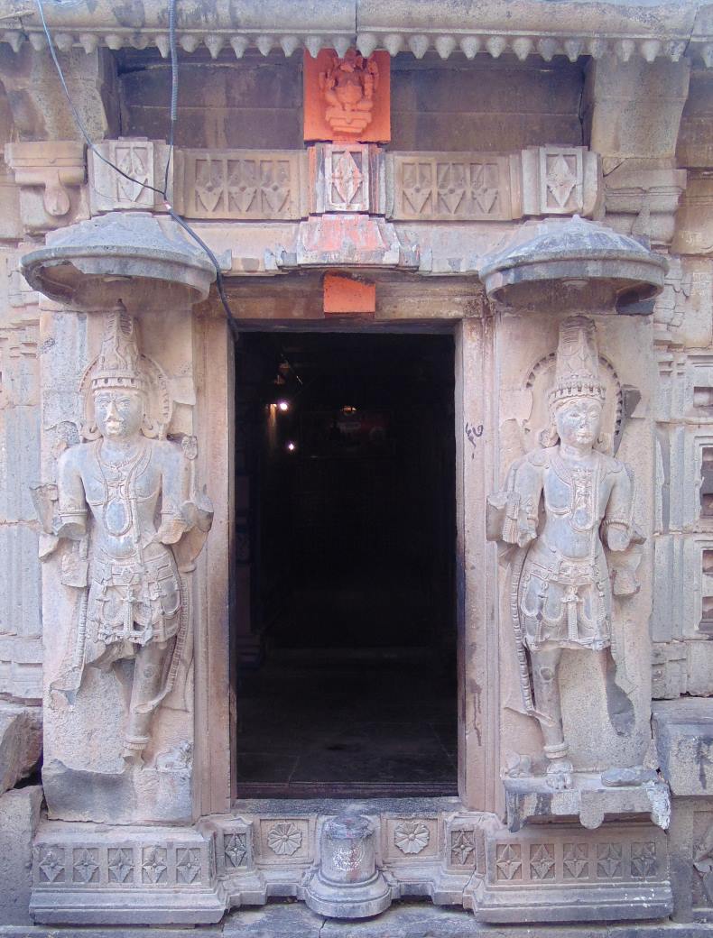 Two Bhairava-like dvārapālas on both sides of the entrance.