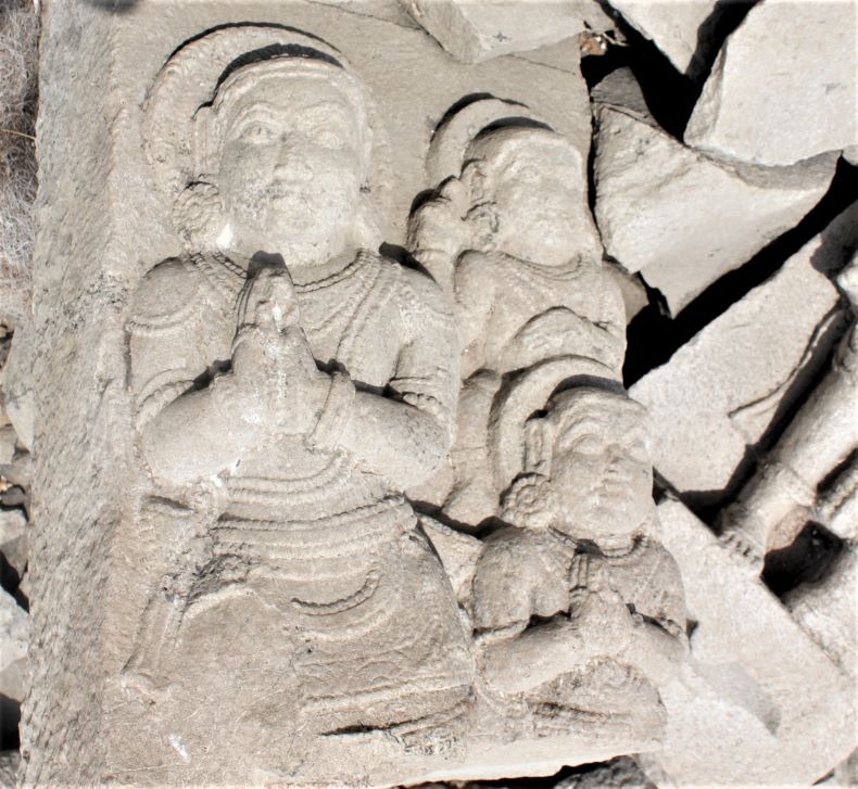 An unidentified sculpture laying down on the northern side of the temple.